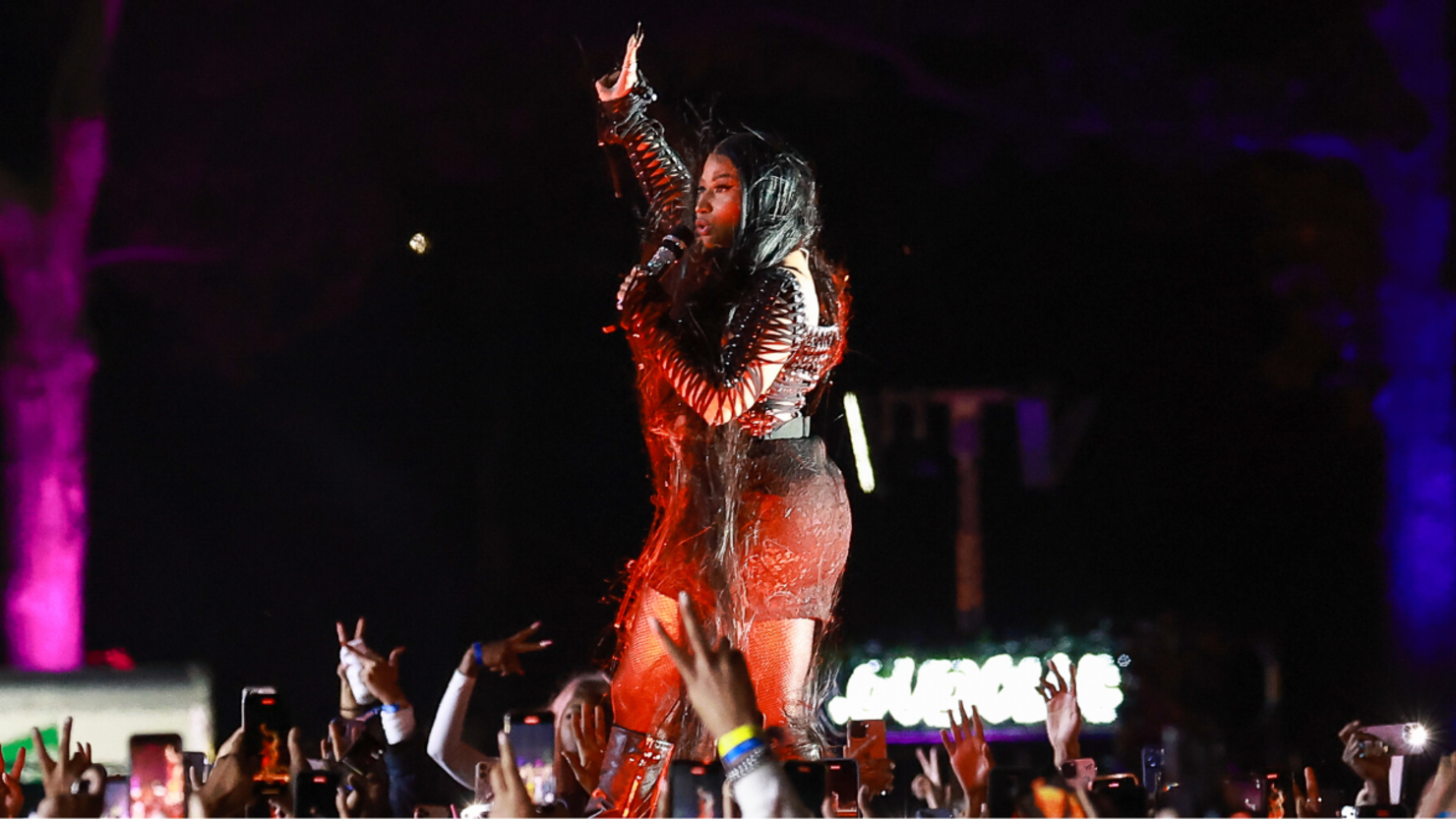 Wearing a pink wig, a stuffed animal-covered dress and rainbow-colored  fuzzy leg warmers, singer Nicki Minaj shoots a new music video on location  in downtown LA. Special guest stars Willow and Jaden