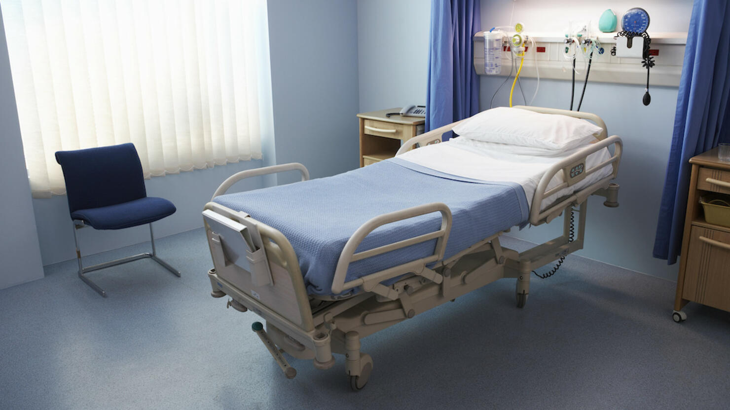 Empty Hospital Bed in a Ward