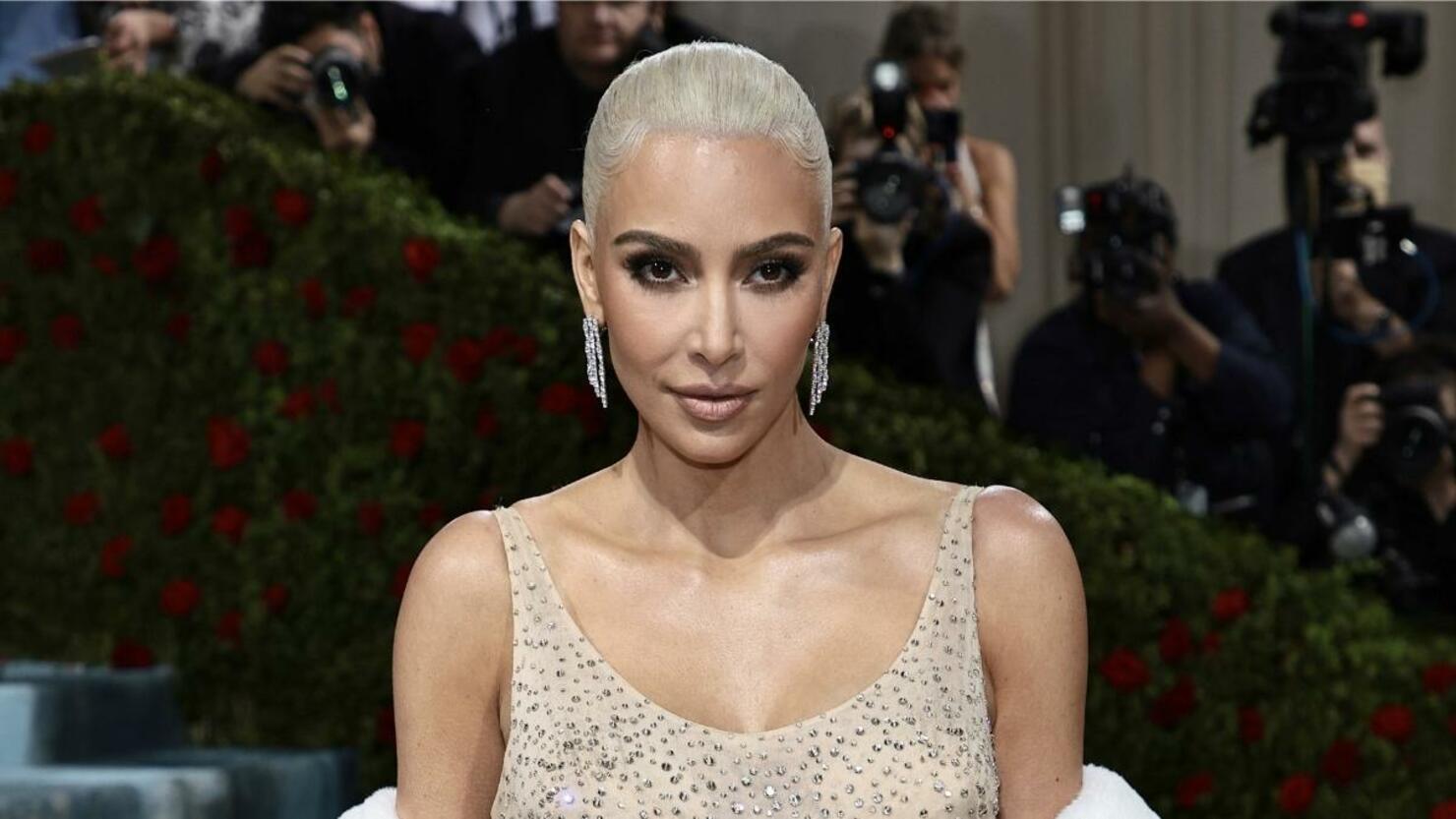 Kim Kardashian Struggles with Stairs in Skintight D&G Dress