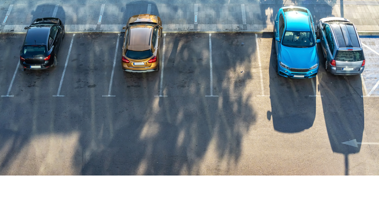 Aerial view of four parked passenger cars.