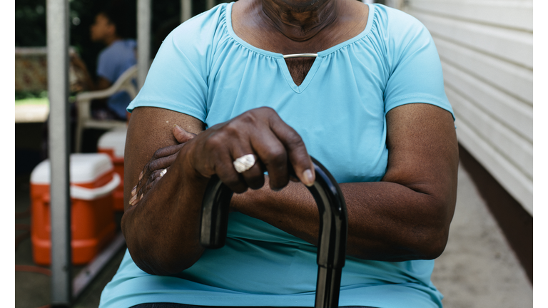 Senior black woman at family cookout.