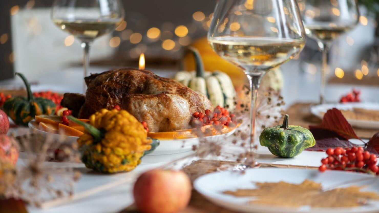 Traditional Festive Dinner With Delicious Roasted Turkey Served On Table