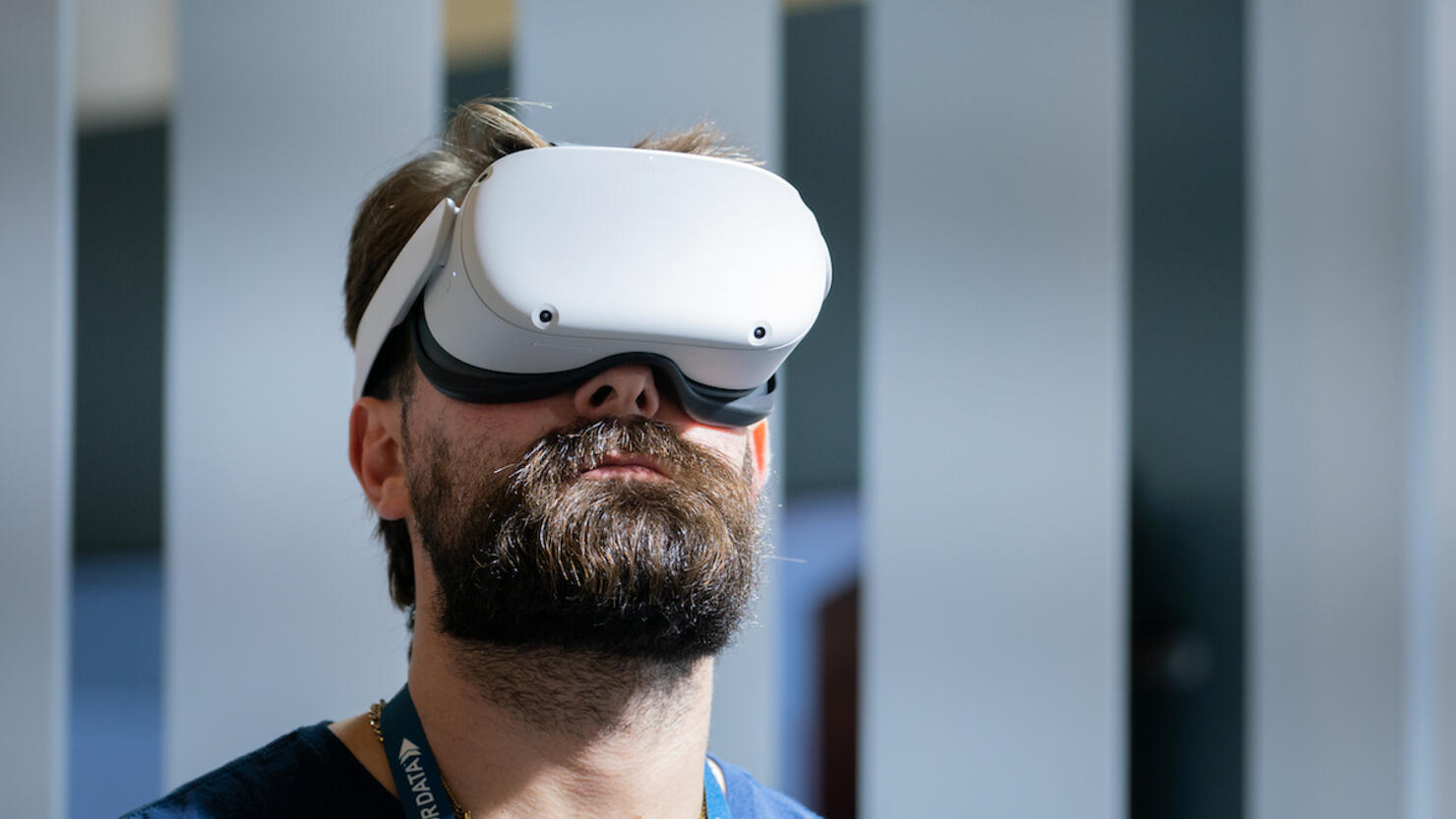 A man wears an Oculus VR Inc virtual reality (VR) headset at