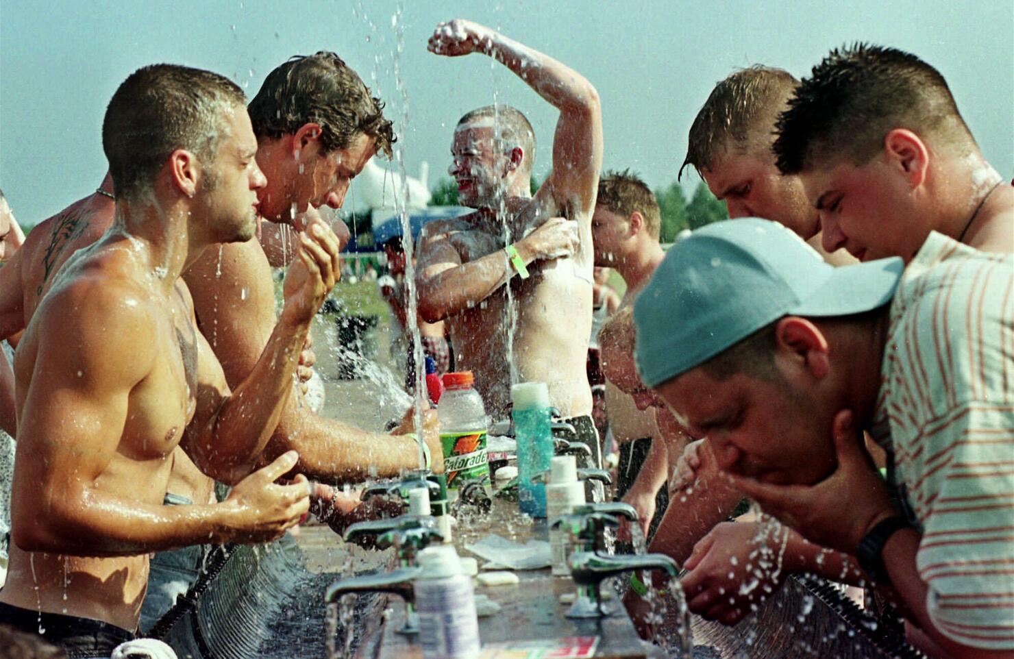 People drinking and bathing in water