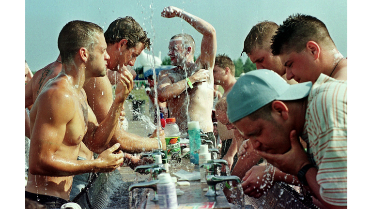 People drinking and bathing in water