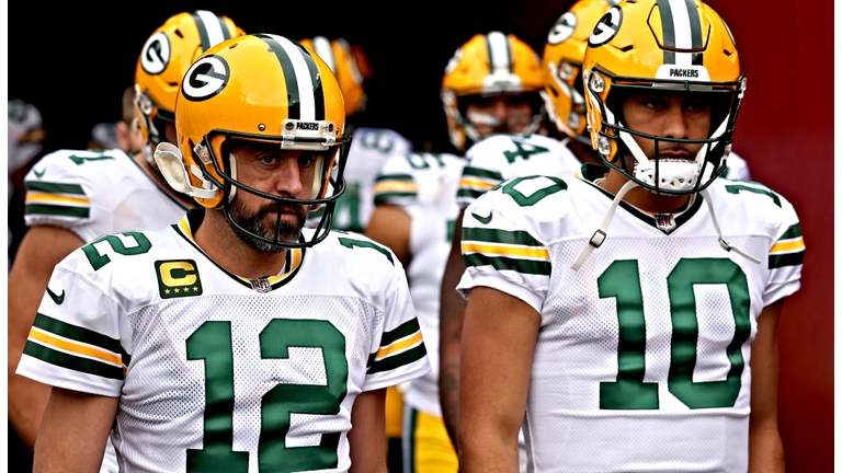 Colin Cowherd: Aaron Rodgers Poked Packers in Ribs With Shirt During 'The  Match' Press Conference