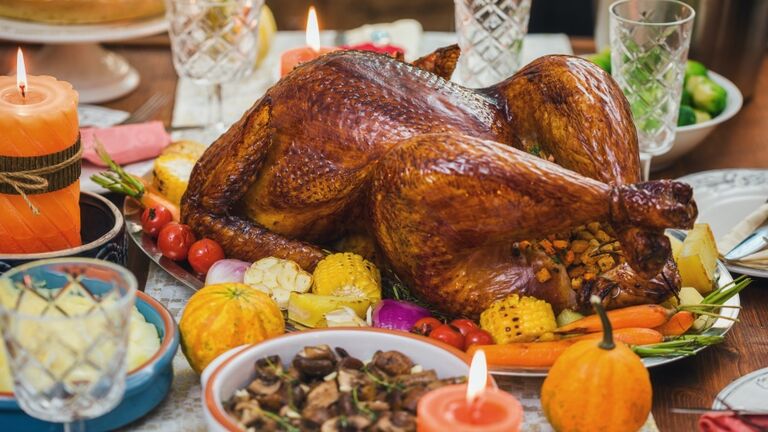 Stuffed Turkey with Side Dishes Served  for Thanksgiving Celebration