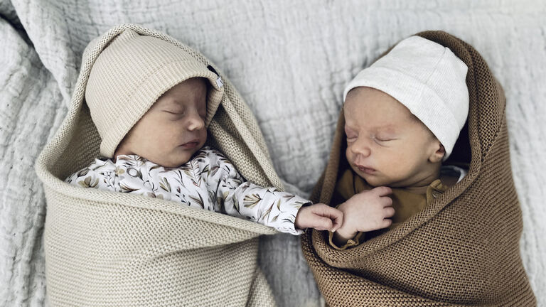 Sleeping new born boy and girl twin