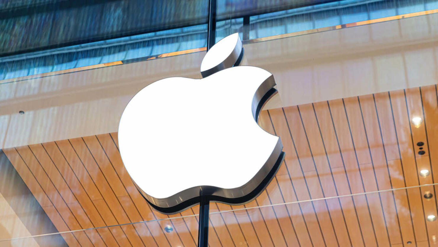 Apple logo seen above the entrance of the Apple store in