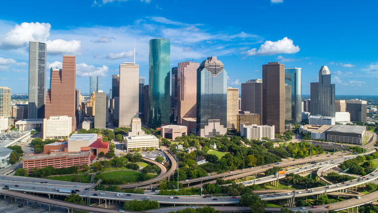 High quality panorama aerial view of Downtown Houston in Texas skyline, with commercial building in a blue sky day.