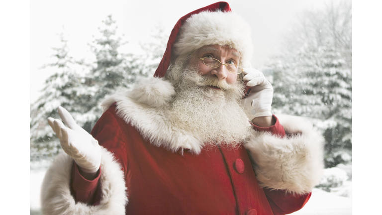 Santa Claus using mobile phone, close-up