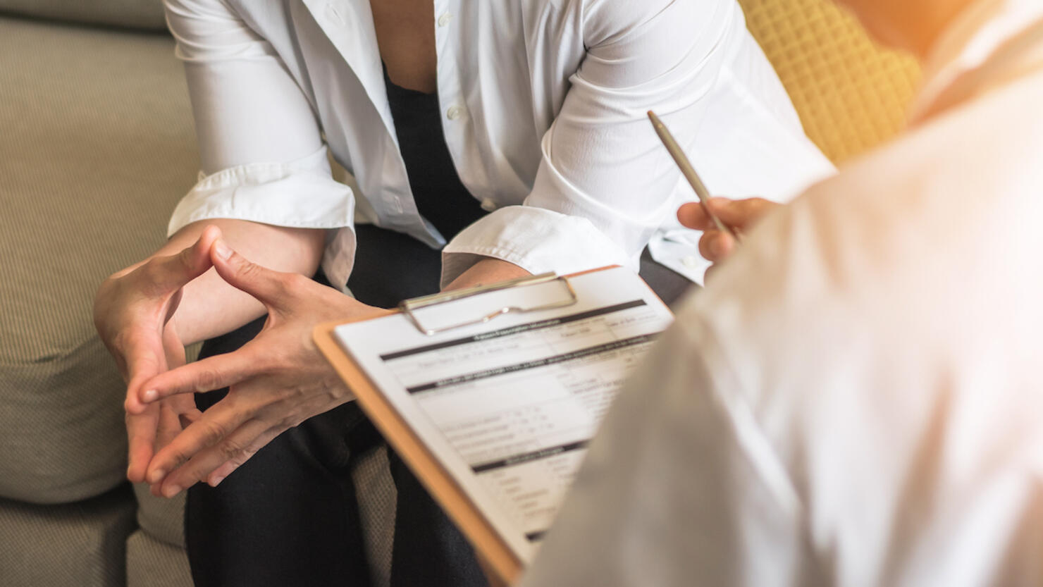 Woman patient with doctor or psychiatrist consulting and diagnostic examining on obstetric - gynecological female illness, or mental health in medical clinic or hospital healthcare service center