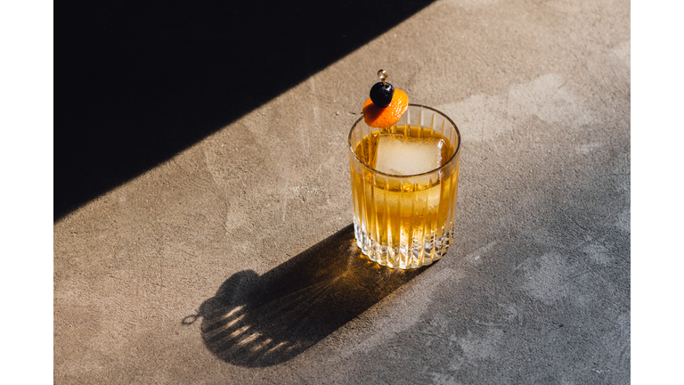 Golden Hour Whiskey Soda Highball Cocktail With Ice, Cherry Orange Peel Garnish