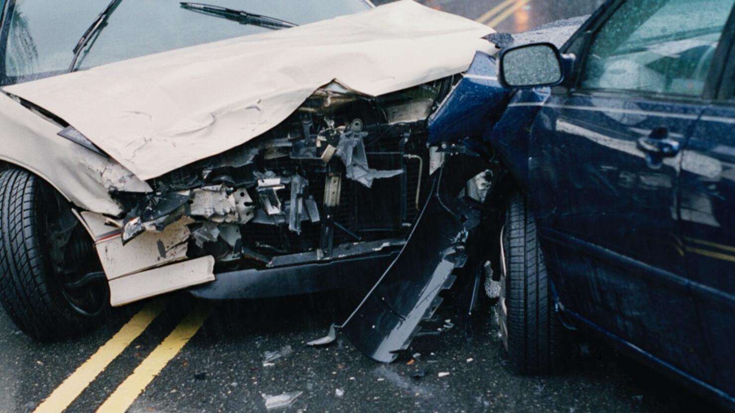 Two damaged cars after crash, close-up