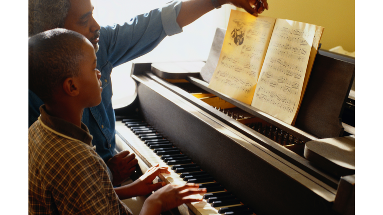 Father and Son Playing the Piano