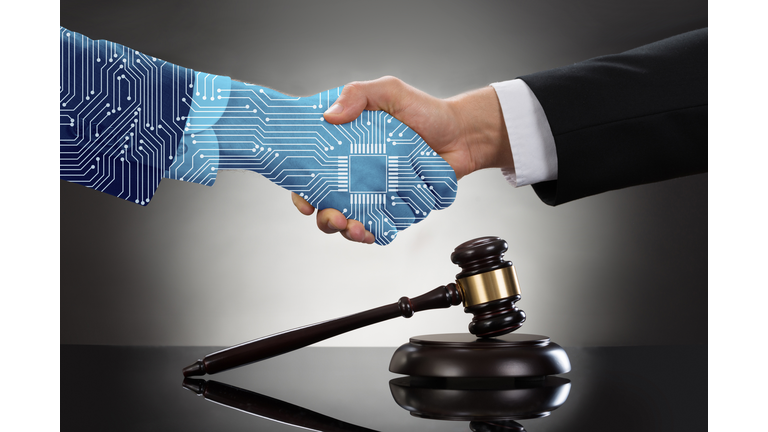 Businessman Shaking Hands In Front Of Mallet