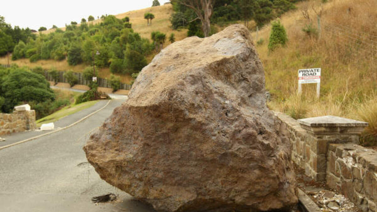 boulder crashes through living room