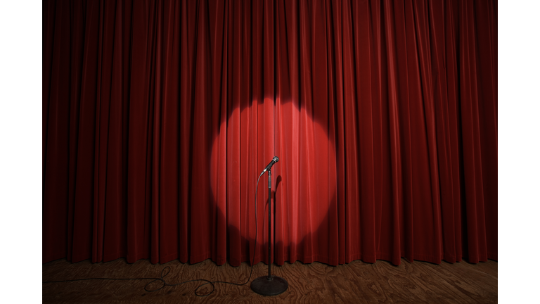 Spotlight on microphone stand on stage
