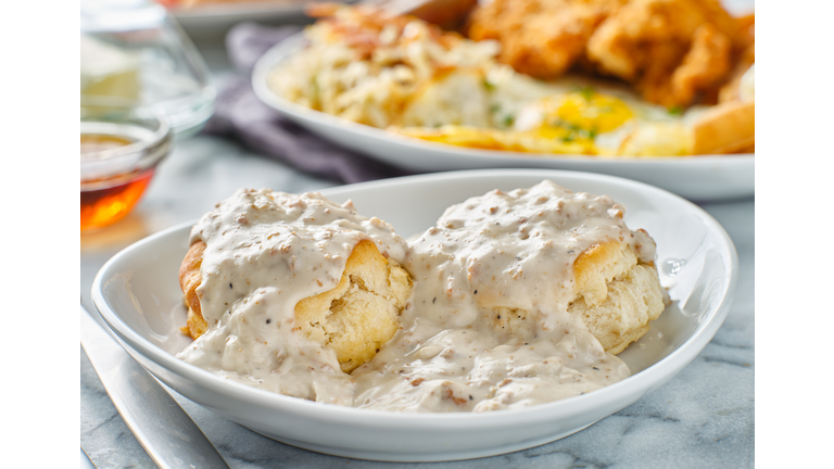 biscuits and gravy with sausage on plate
