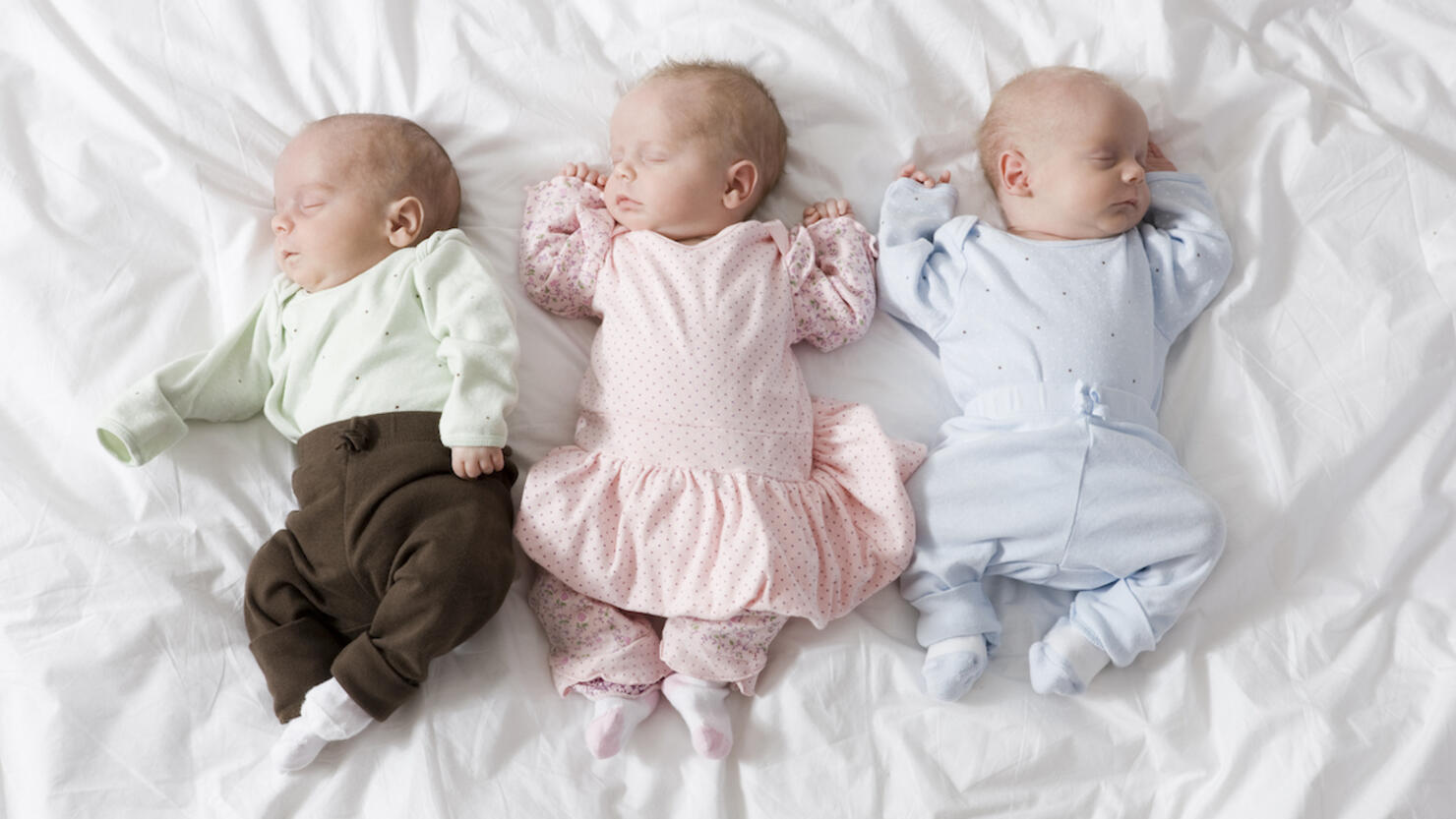 newborn triplets asleep