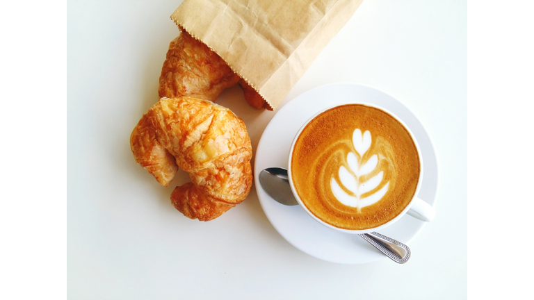 High Angle View Of Cappuccino With Croissant On White Background