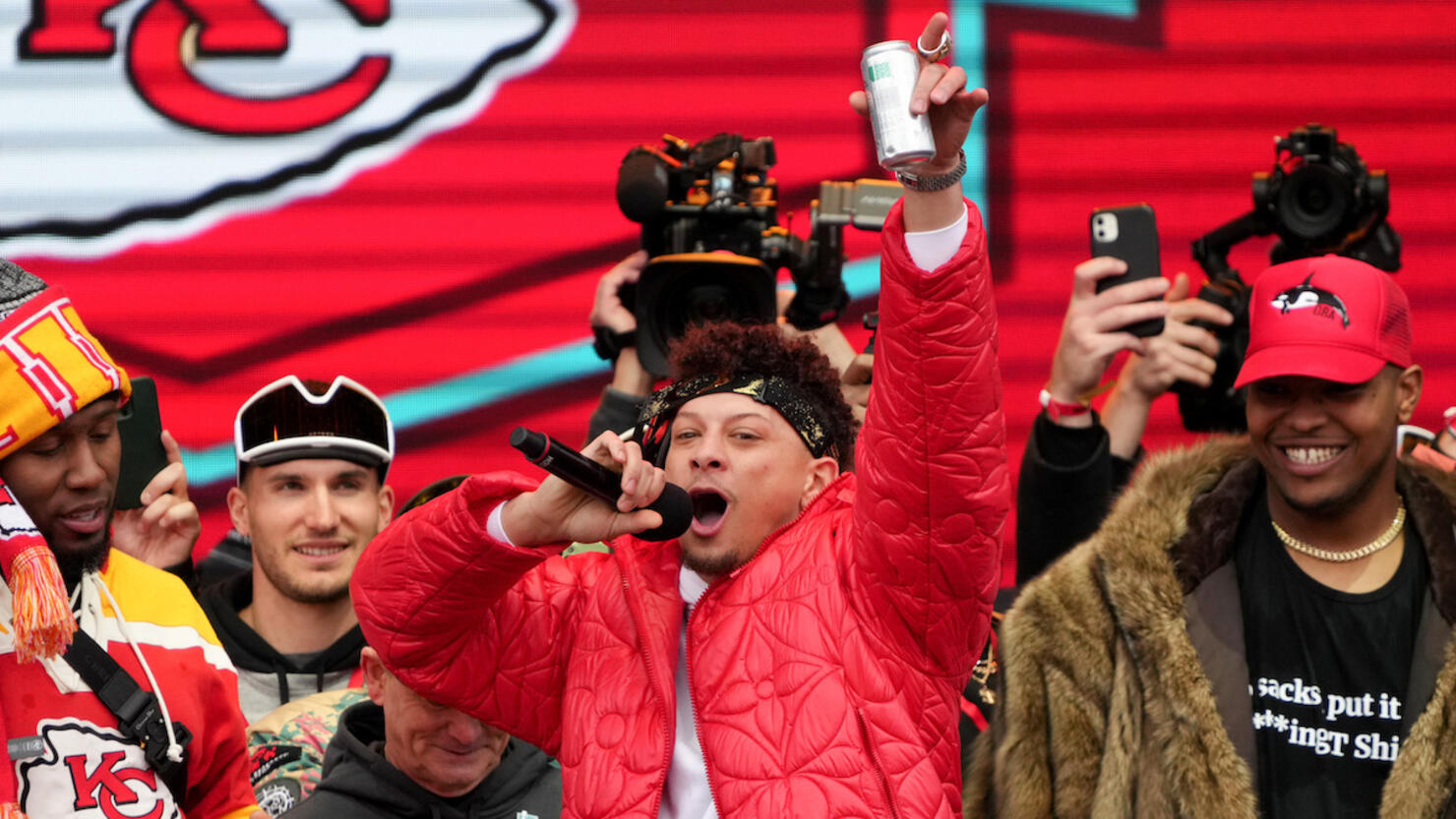 Patrick Mahomes Celebrates Super Bowl Victory with Trophy, WWE Belt