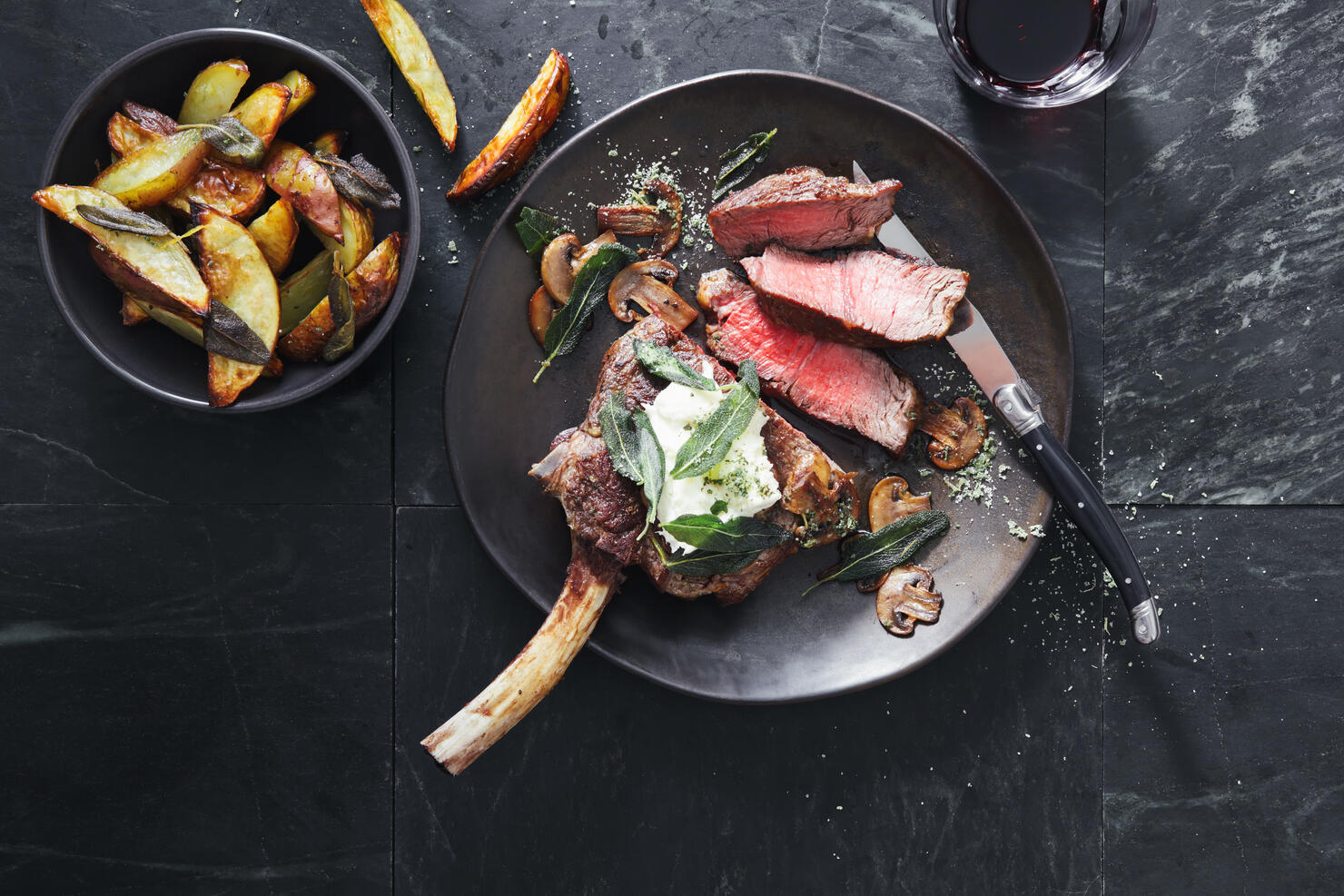 Tomahawk beef steak with mushrooms, burrata and sage potato wedges