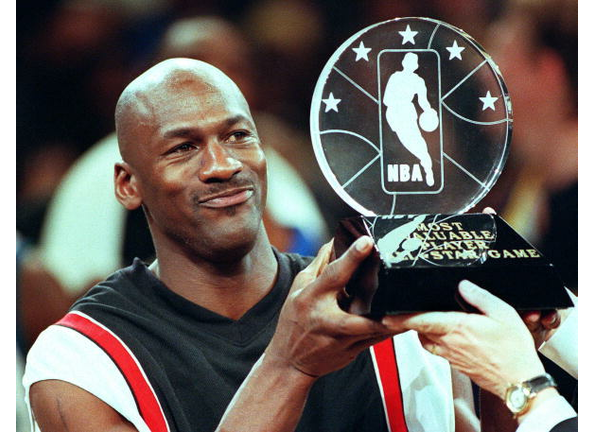 Chicago Bulls' Michael Jordan holds up the Most Va
