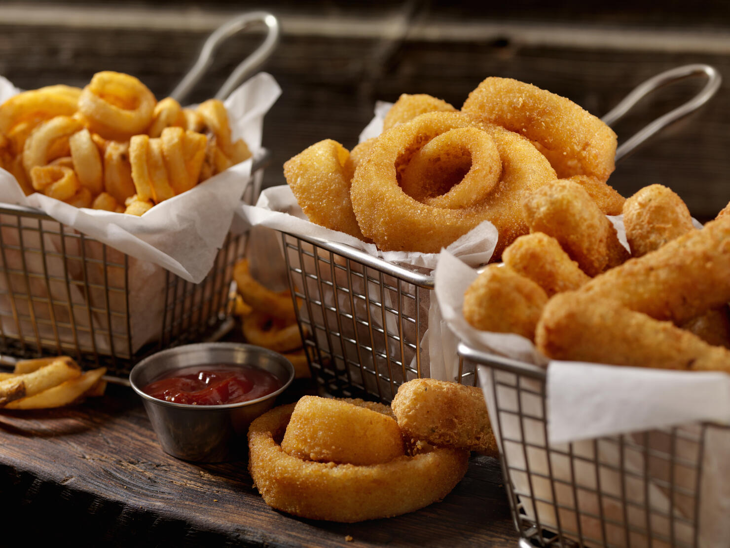 Baskets of Onion Rings, Curly Fries and Cheese Sticks