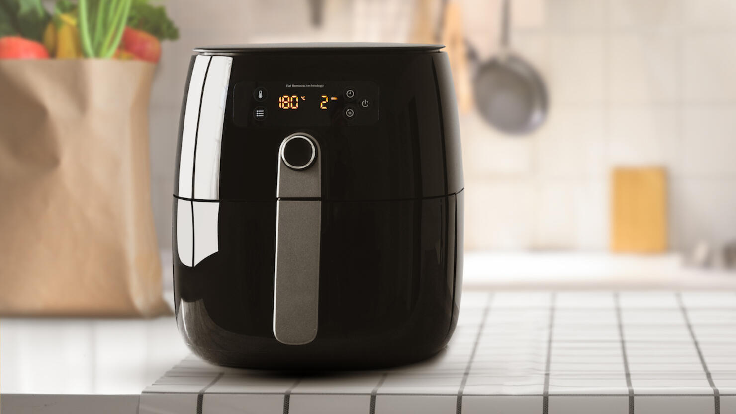 Air fryer machine cooking potato fried in kitchen. Lifestyle of new normal cooking.