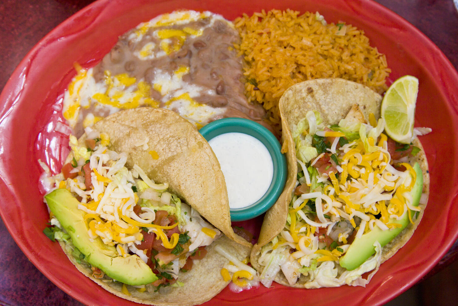 Tacos dinner with rice and re fried beans