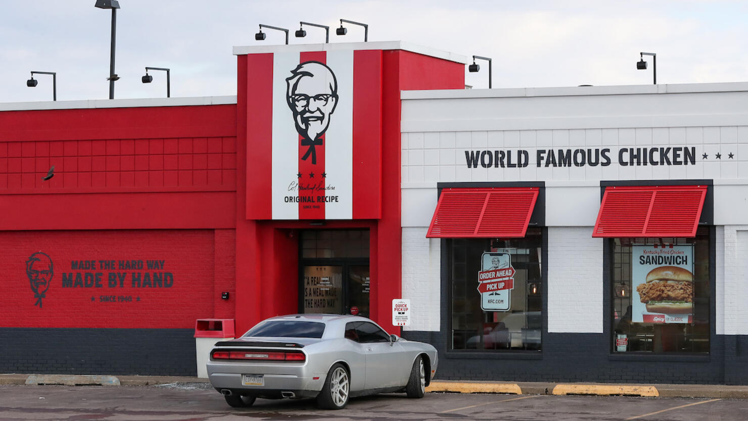 A car is seen parked outside a KFC restaurant