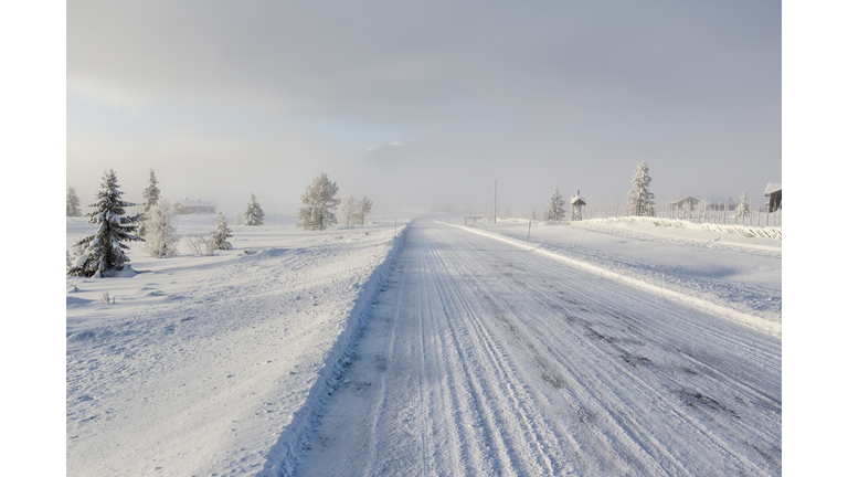 Frozen road in snow landscape,Norway.