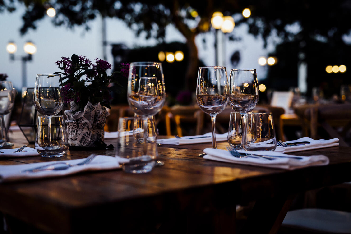 Luxury table settings for fine dining with and glassware, beautiful blurred  background. For events, weddings.