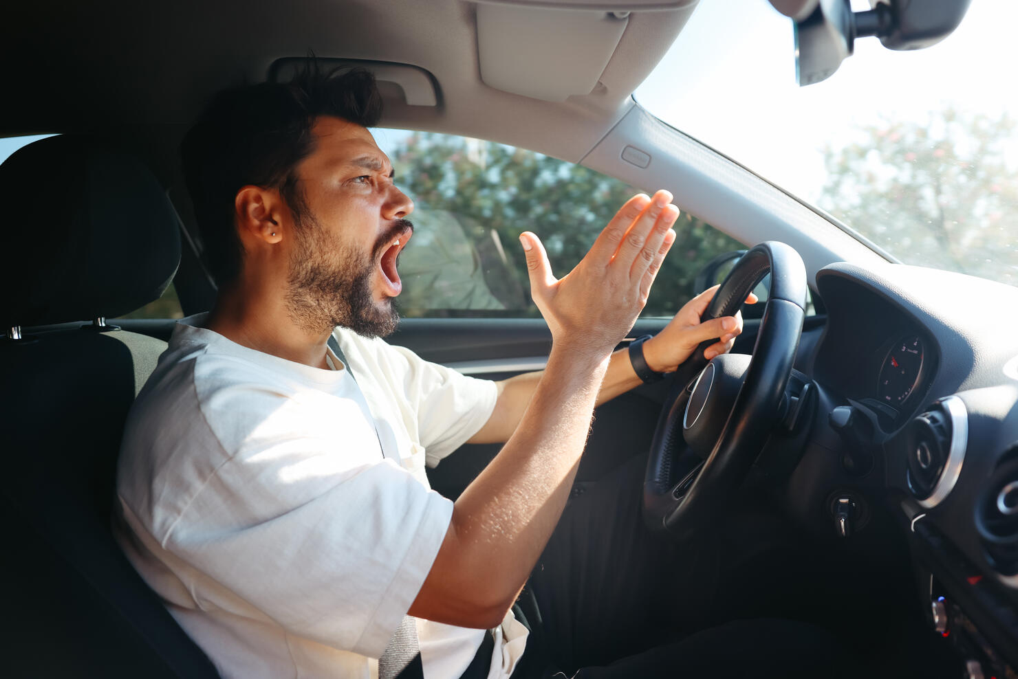 Young man getting angry on the road