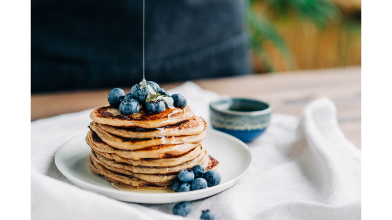 Homemade Pancakes  with blueberries and honey.