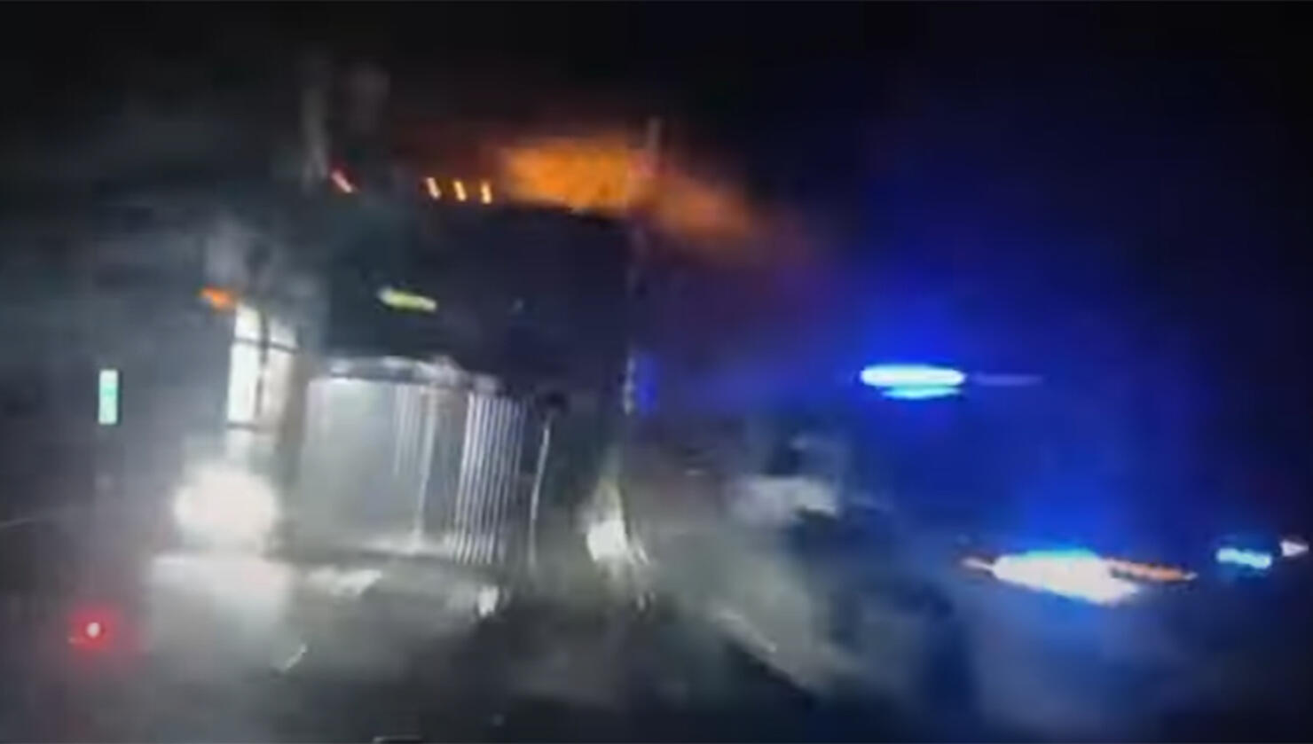 Semitruck slams into police cars