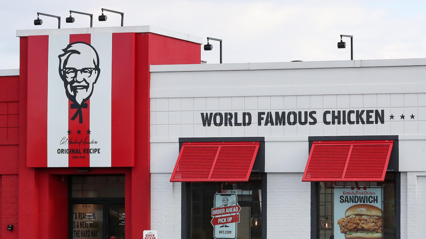 A car is seen parked outside a KFC restaurant