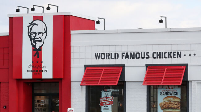 A car is seen parked outside a KFC restaurant