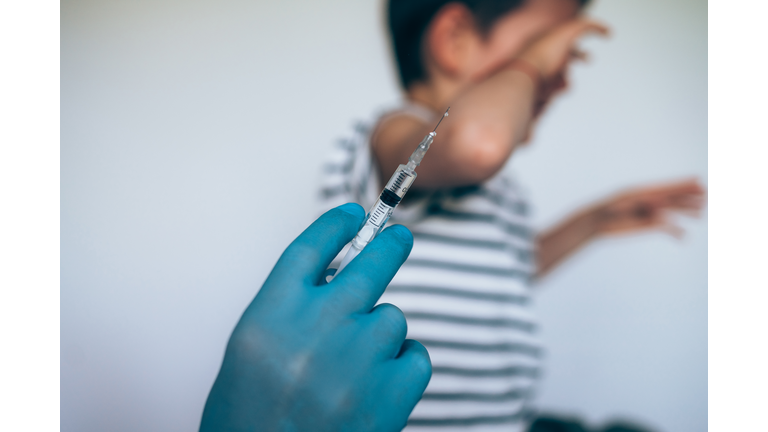 Little boy getting a vaccine.