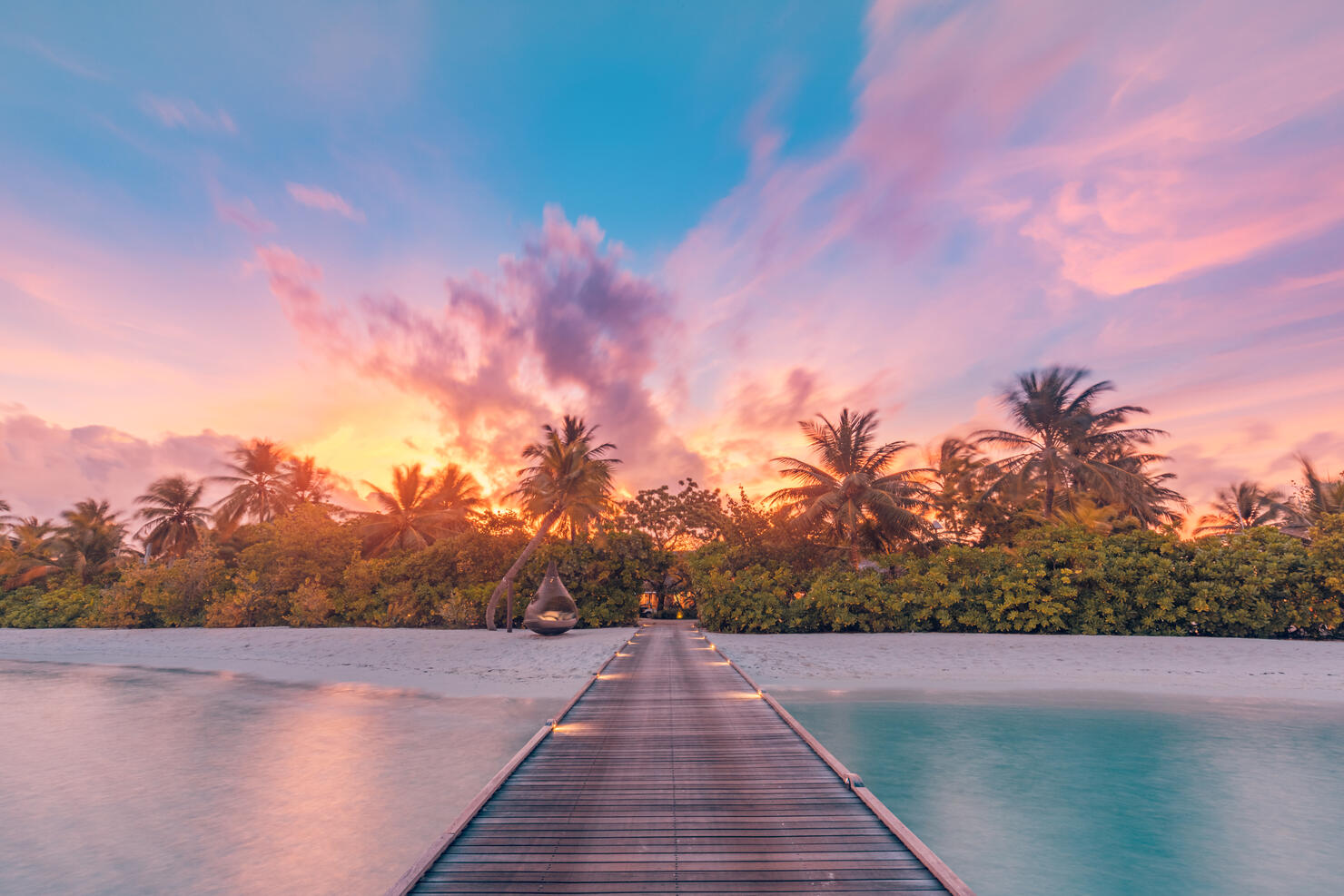 Beautiful sunset beach scene. Colorful sky and clouds view with calm sea and relaxing tropical mood