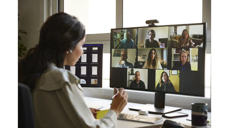 Businesswoman planning strategy on video call