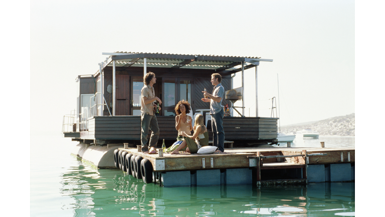 Adults hanging out on a boat