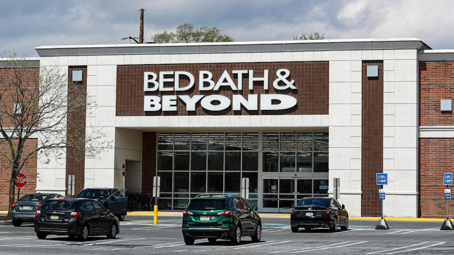 Cars are seen in the parking lot of the Bed Bath & Beyond