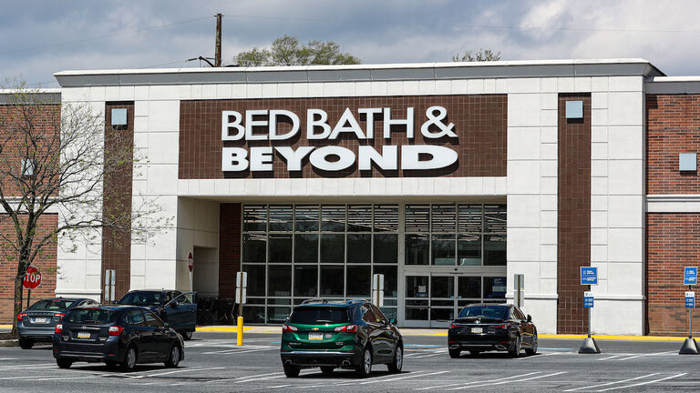 Cars are seen in the parking lot of the Bed Bath & Beyond