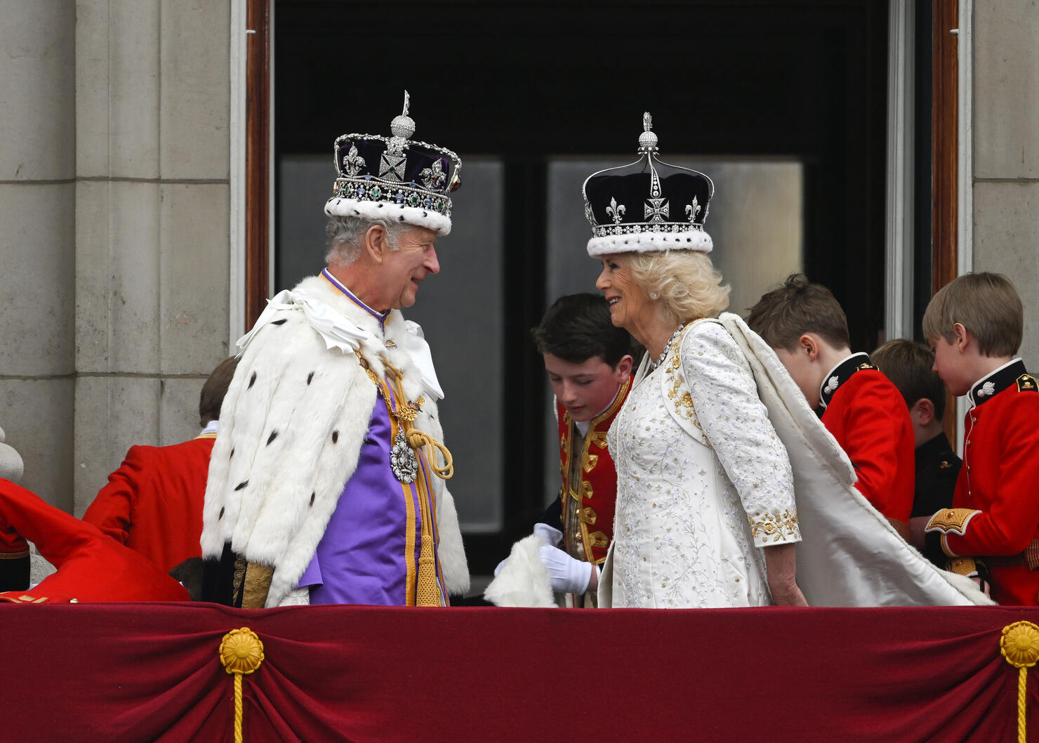 King Charles III and <b>Queen</b> Camilla can be seen on the Buckingham Palace bal...