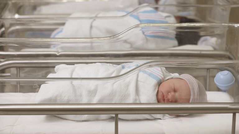 Newborn babies sleeping in hospital nursery