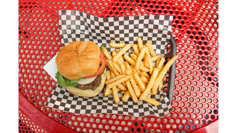 Hamburger and French Fries on Tray Outdoors