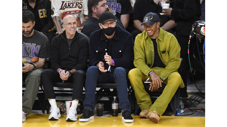 Kendall Jenner, center, sits courtside with Bad Bunny during the second  half in Game 6 of an NBA basketball Western Conference semifinal series  between the Los Angeles Lakers and the Golden State