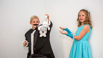 A Little Girl's Magic Trick Fails, so She Kicks Her Brother in the Butt